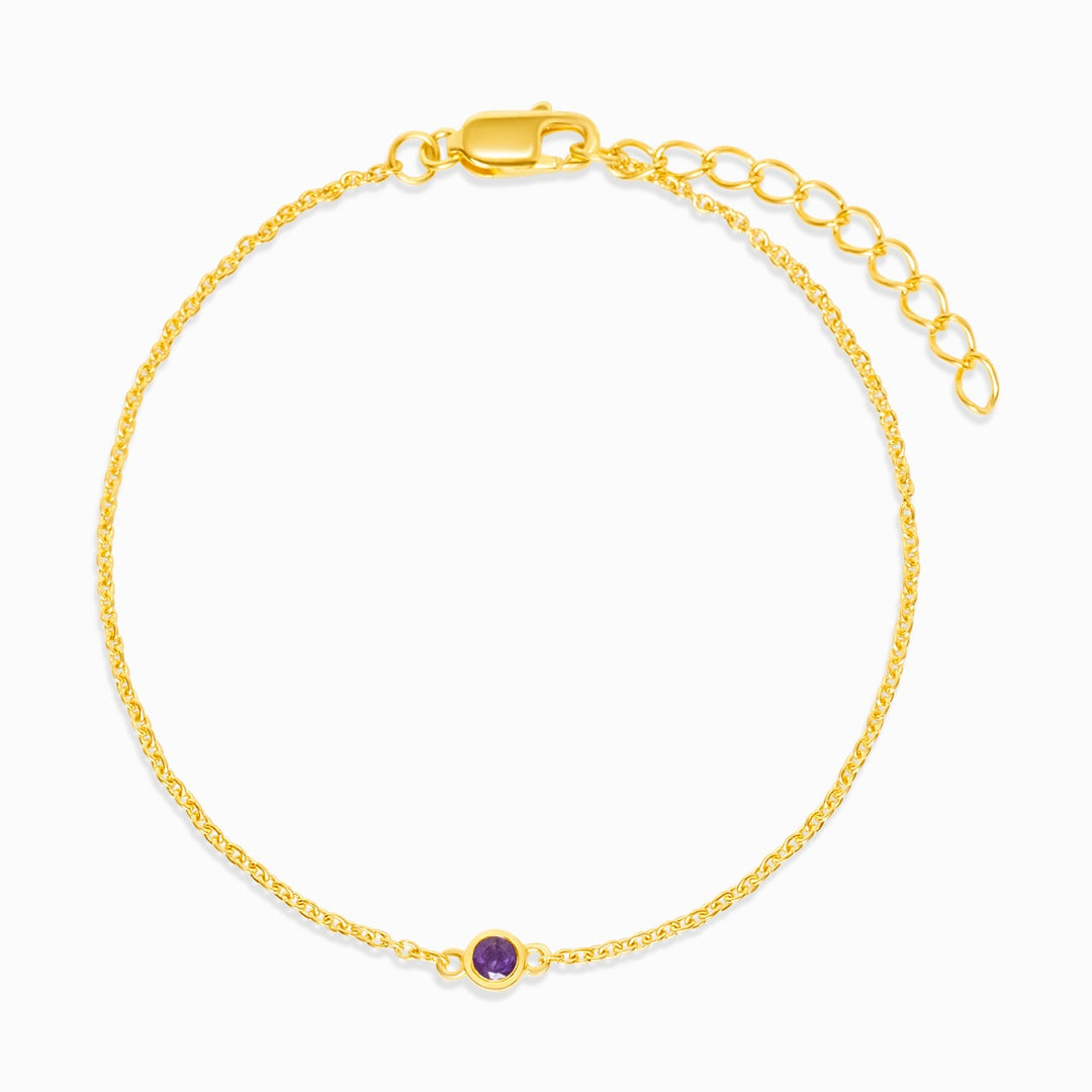 Guldarmband med lila Ametist som är februari månadssten. Smycke med Ametist kristall att bära som armband i guld.